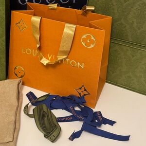 Gucci and Louis Vuitton Shopping Bags and Boxes